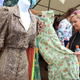Vintage clothing shopping. Image via Getty.